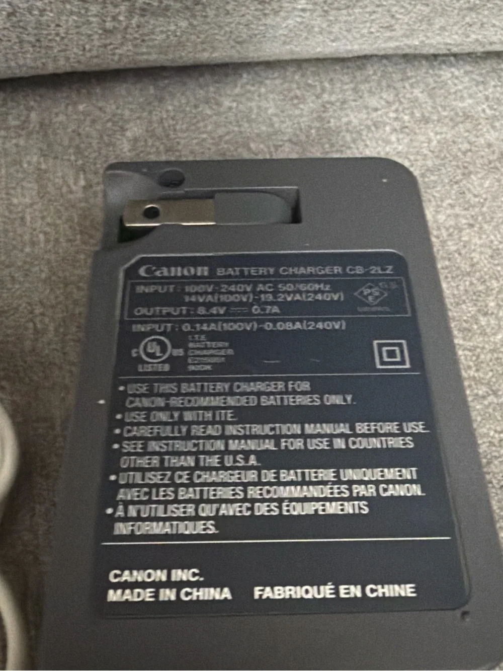 Canon Black Battery Charger with Silver LP-E12 Battery and White USB Cable